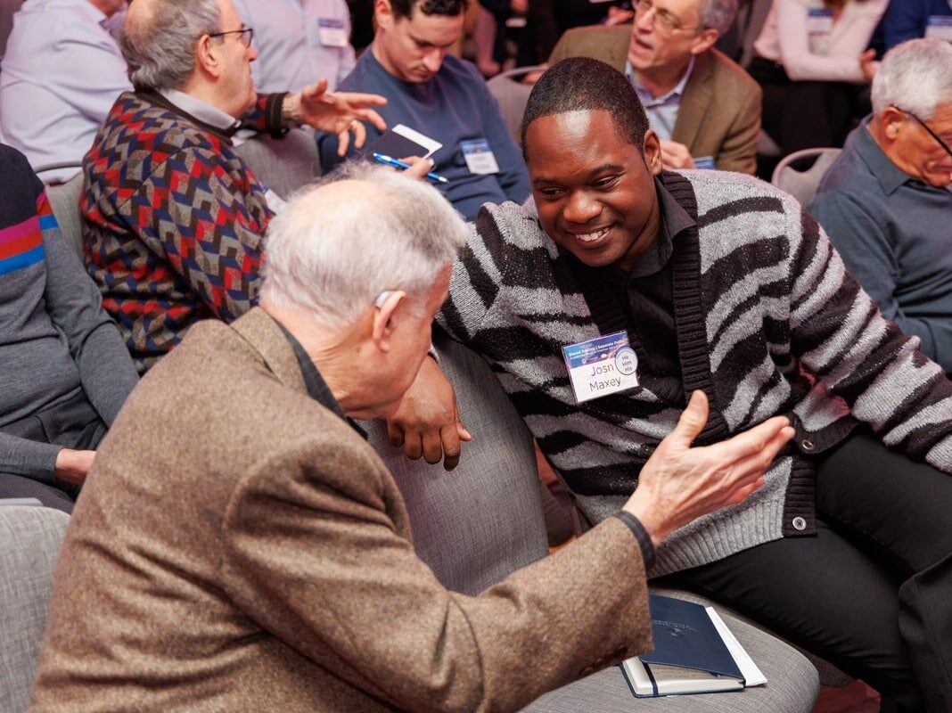 Two men in discussion at a Shalom Hartman event