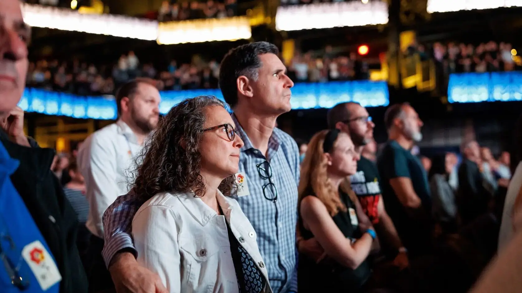 A man and woman stand in the audience of the Anthem building