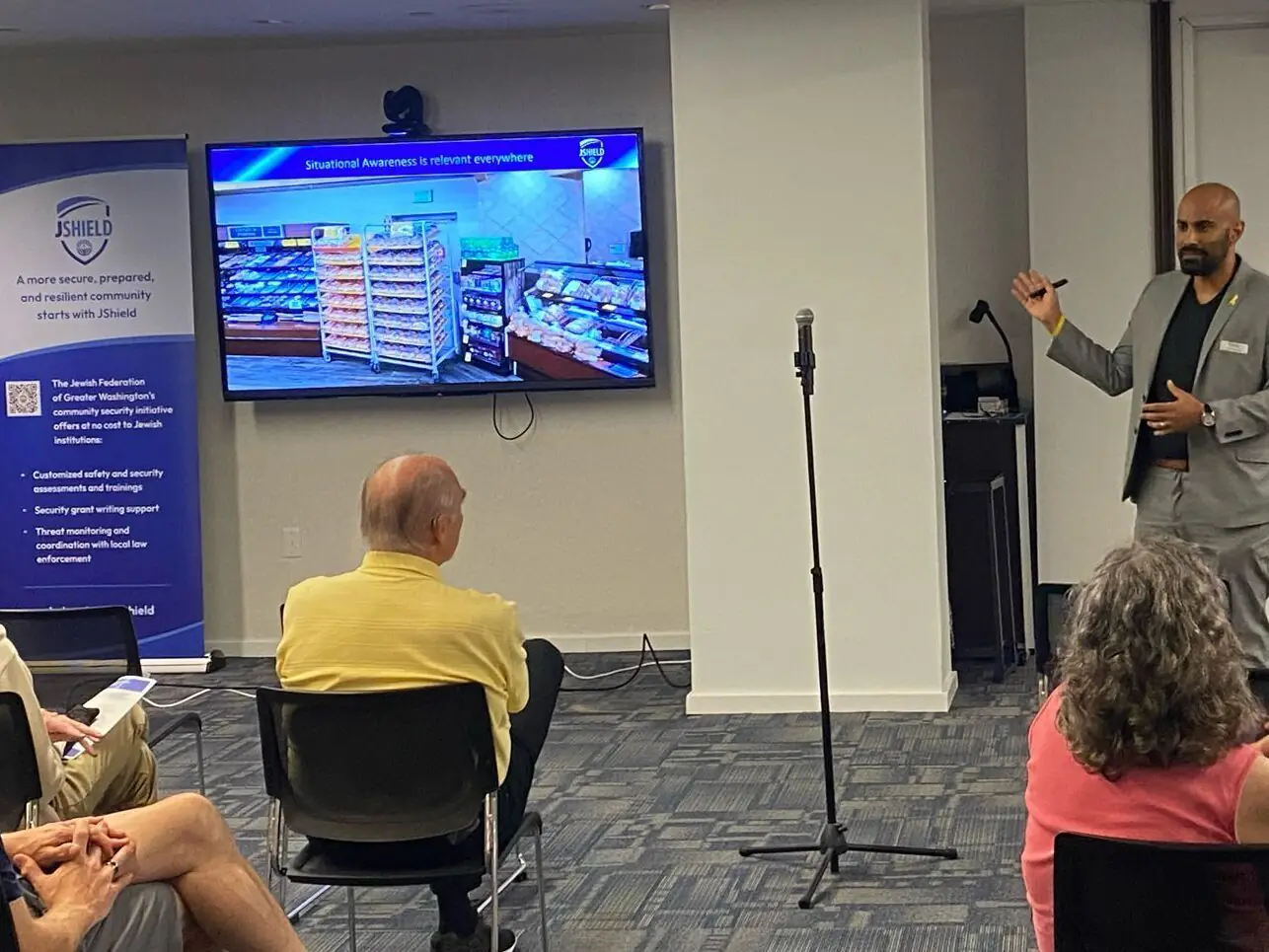 Man standing in front of audience.