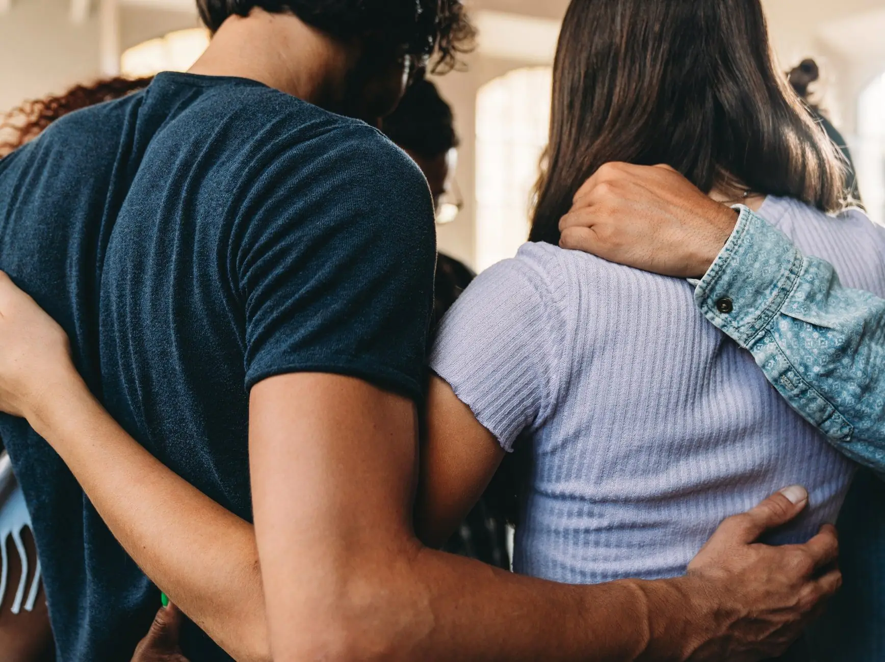 People embracing together.